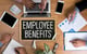 employee benefits written on desk with person working