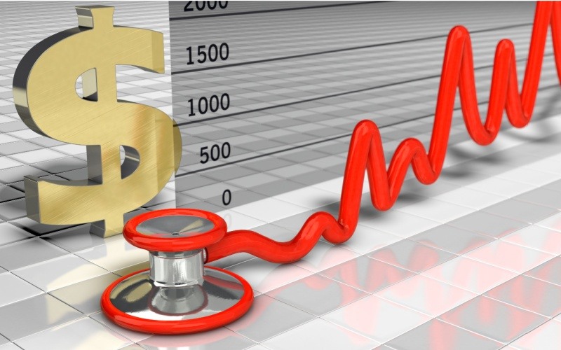 dollar sign and stethoscope with chart