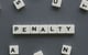 penalty spelled out in letter tiles