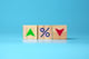 wood blocks with percentage sign with up and down arrows
