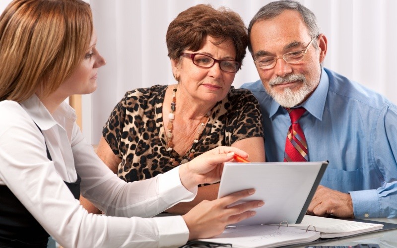 Senior couple meeting with advisor