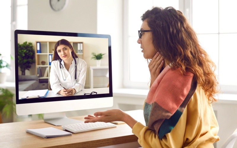 woman talking to doctor through computer