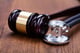 gavel with stethoscope on table