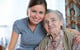 elderly woman posing with young woman