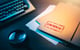 paper files on desk that read confidential