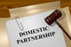 file folder with domestic partnership written on it with gavel