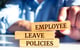 Man stacking wood blocks that reads employee leave policies