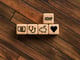 wood block with medical icons that reads HDHP