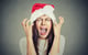 lady wearing Santa hat screaming