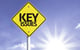 yellow sign that reads key issues