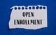 open enrollment written on torn notebook paper