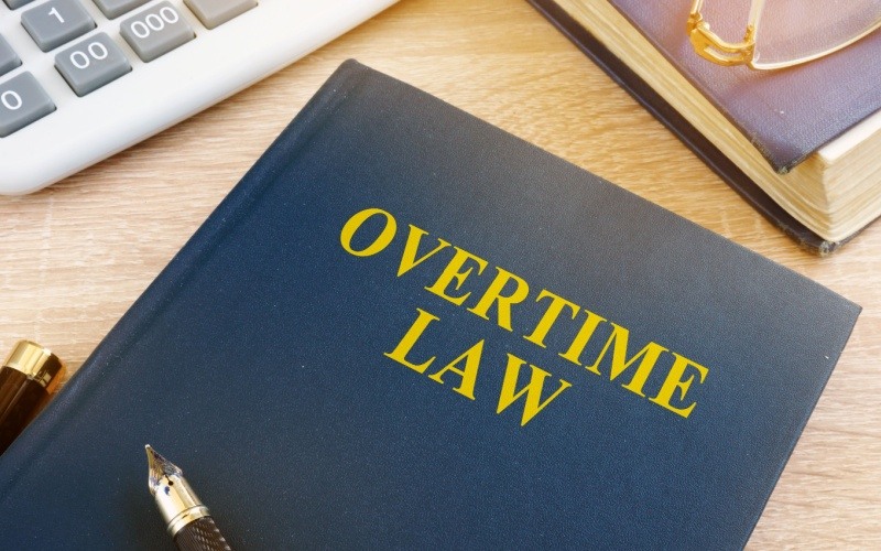 book on desk that reads overtime law