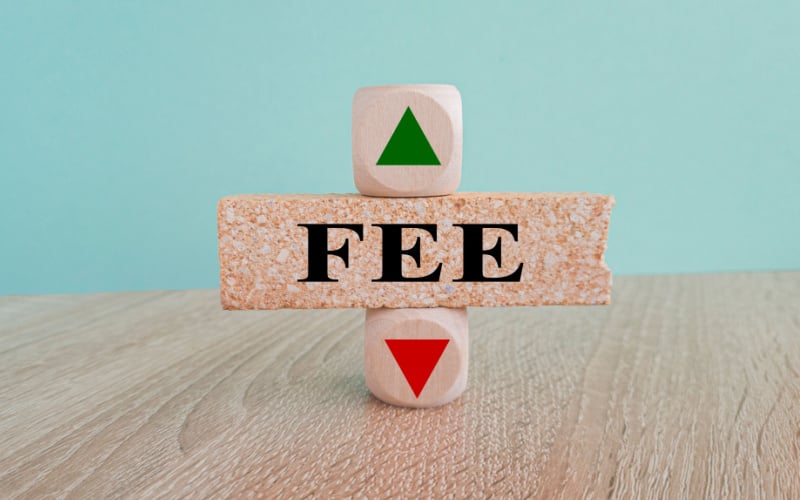 fee written on wood blocks with up and down arrow