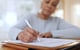 older woman filling out paperwork