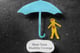 paper cut out doll under umbrella