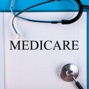 Medicare written in notebook with stethoscope