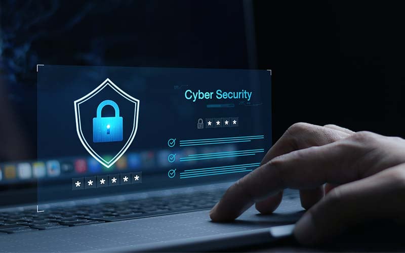 hand typing on computer that reads cyber security