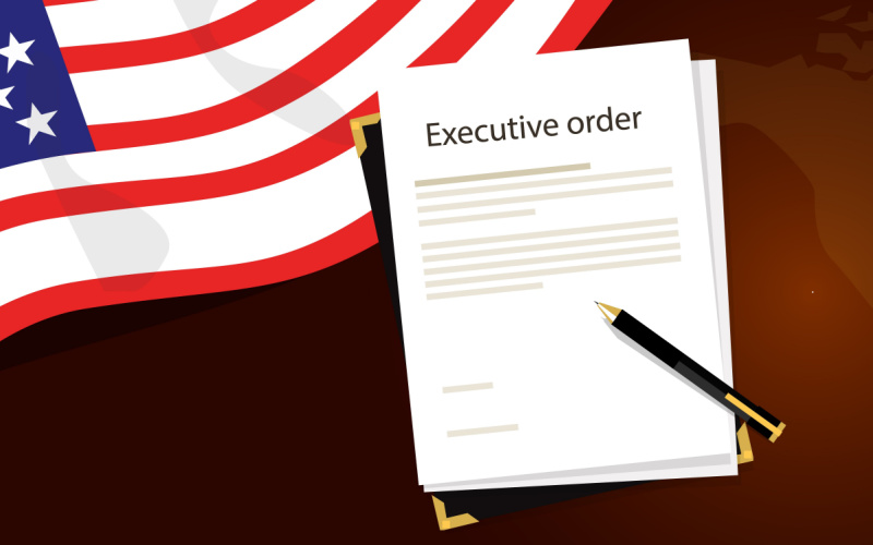 executive order written on paper with American flag