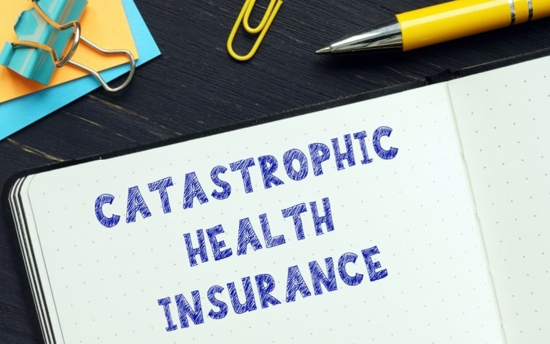 catastrophic health insurance written in notebook