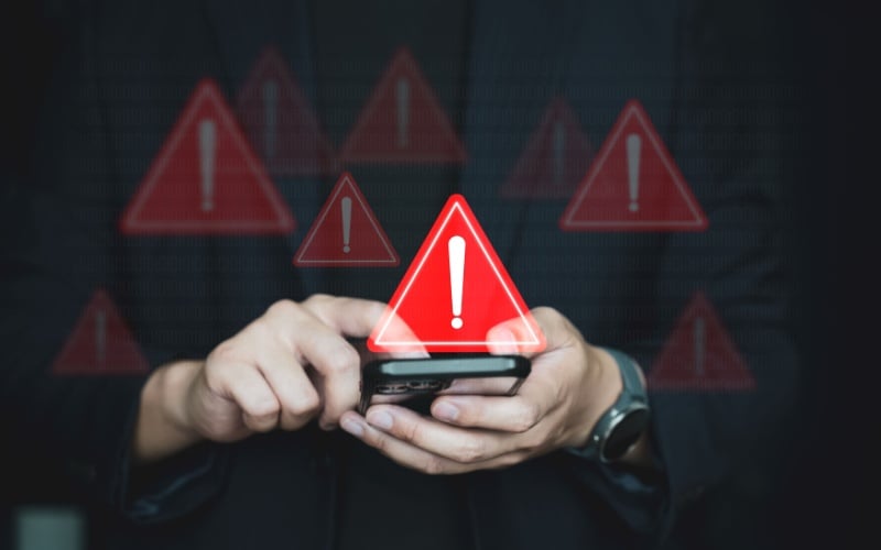 exclamation point in red triangle