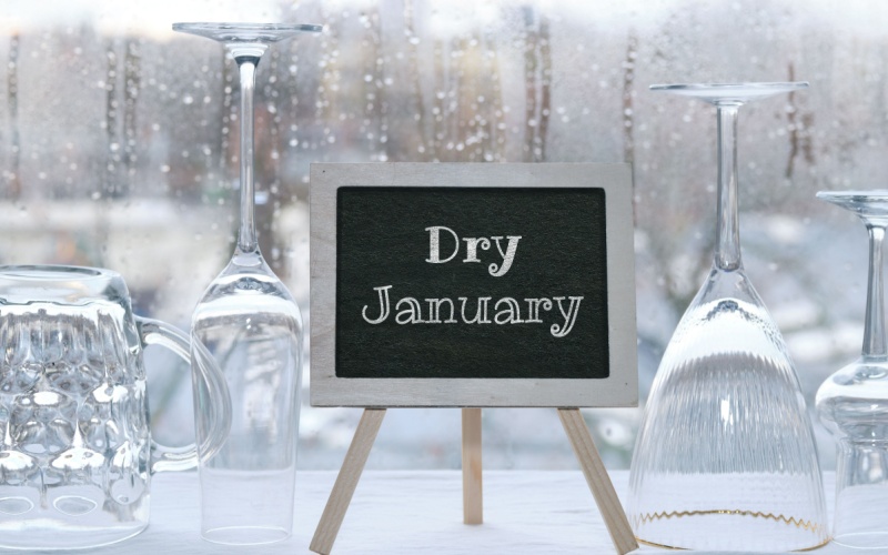 cups turned upside down and sign that reads dry January