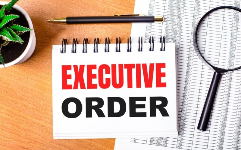 executive order written in notebook