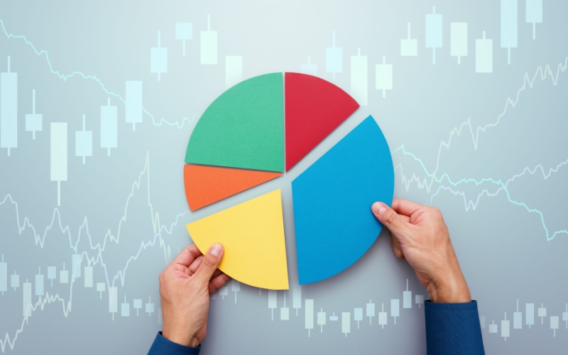 hands holding pie chart pieces