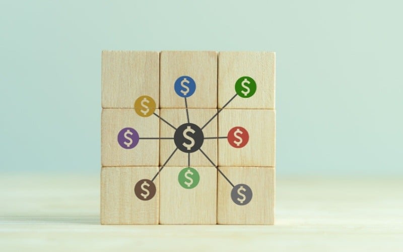 group of wooden blocks with dollar signs on them