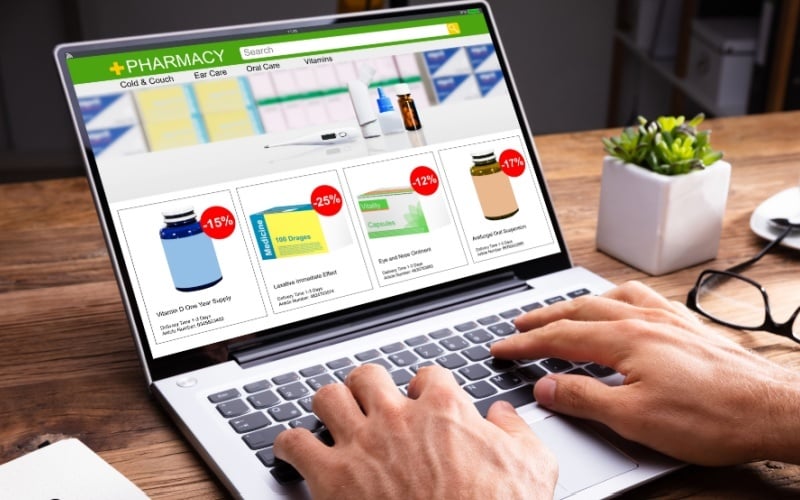 person on computer shopping for medication