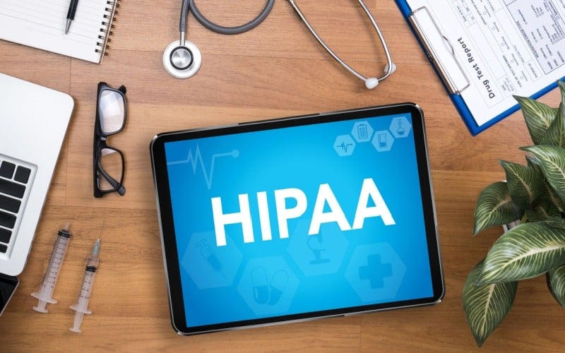 ipad sitting on desk that says HIPAA