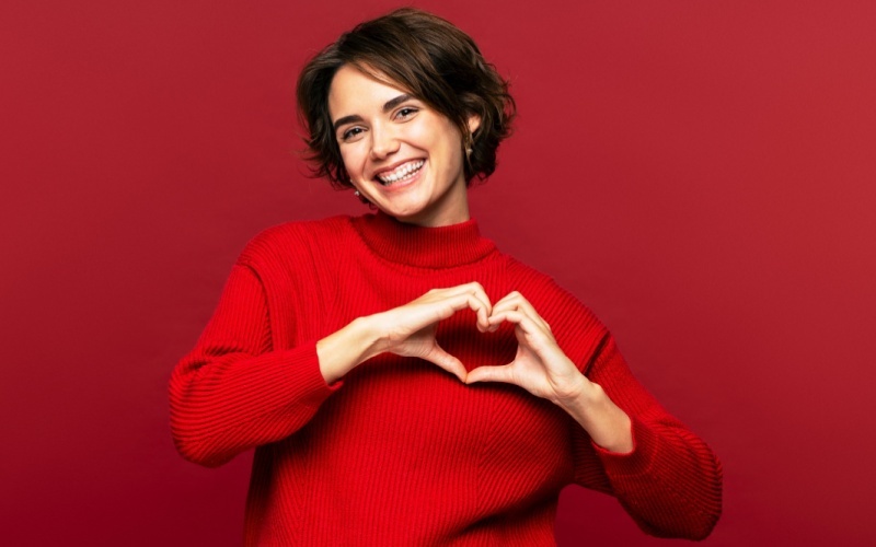 woman making heart shape with her hands