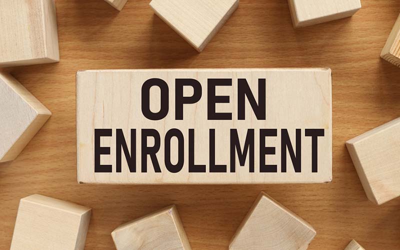 wood blocks that say open enrollment