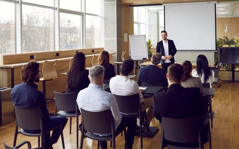 group of employees sitting in a presentation