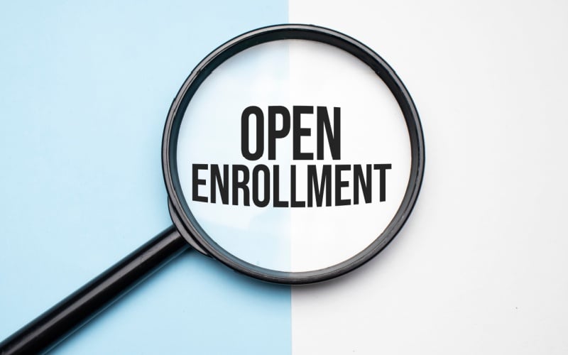 magnifying glass that says open enrollment