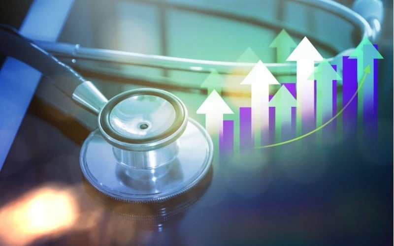 stethoscope with healthcare statistics with graph