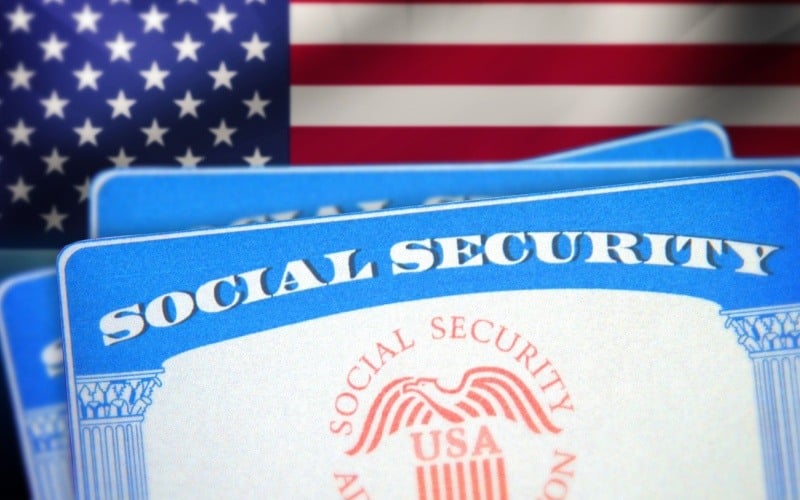 social security card in front of American flag