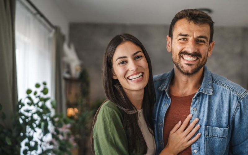 man and woman smiling