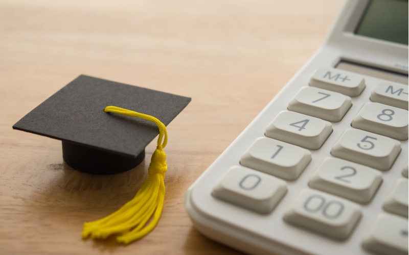 mortarboard and calculator
