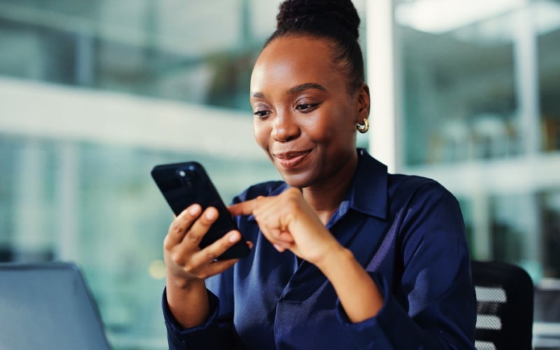 woman looking at her cell phone