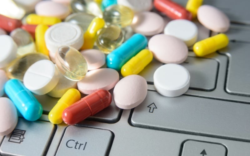 pills sitting on keyboard