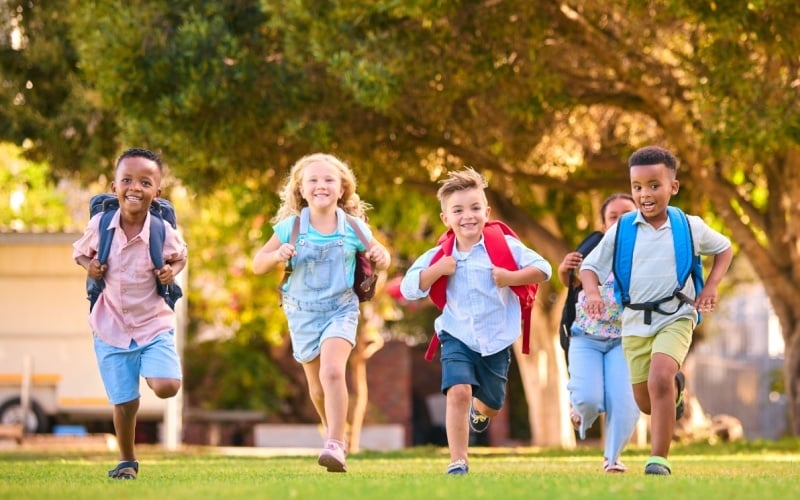 group of school kids running