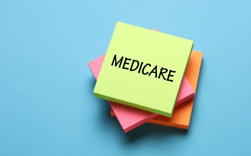 Medicare written on colorful post it notes